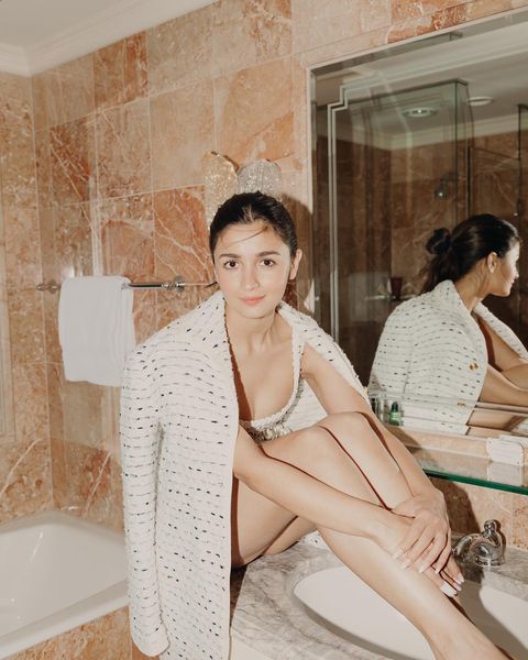 Alia bhatt posing in bathtub showing glamour in short hot dress