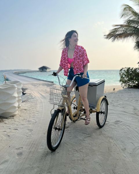 Tamanna rides cycle in hot bikini dress