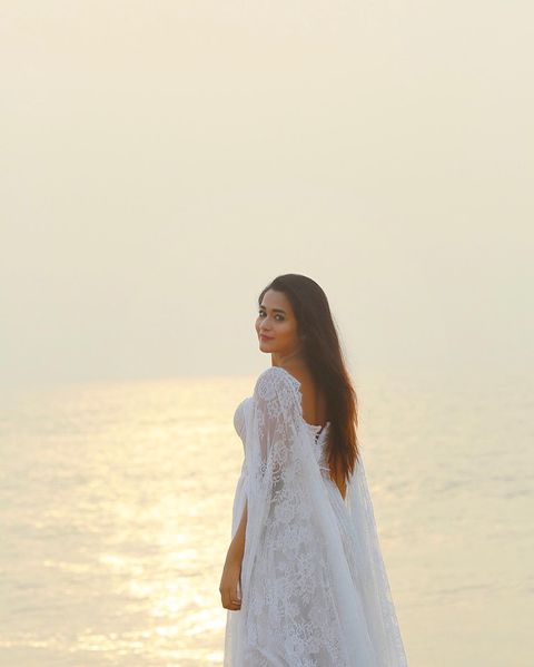 Kavya arivumani hot posing in bridal white dress cute photos