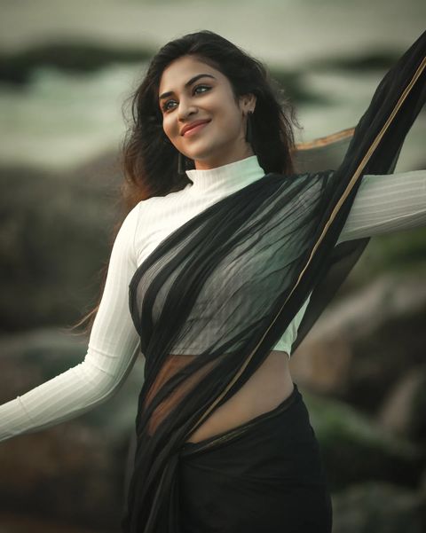 Indhuja ravichandran posing in black colour transparent saree getting viral