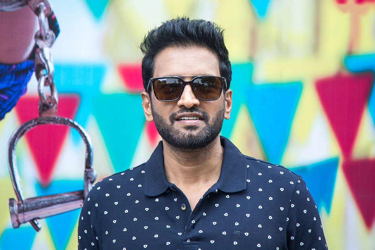 santhanam caught in issue for catching tiger tail and posting video of it