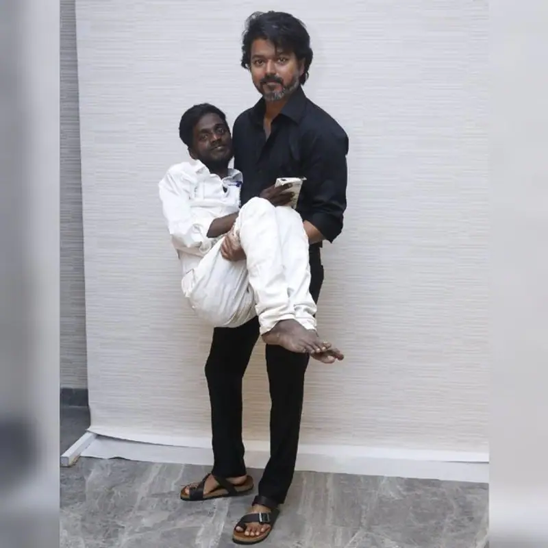 thalapathy vijay pose with physically challenged fan trolled by netizen as he pose for varisu promotion